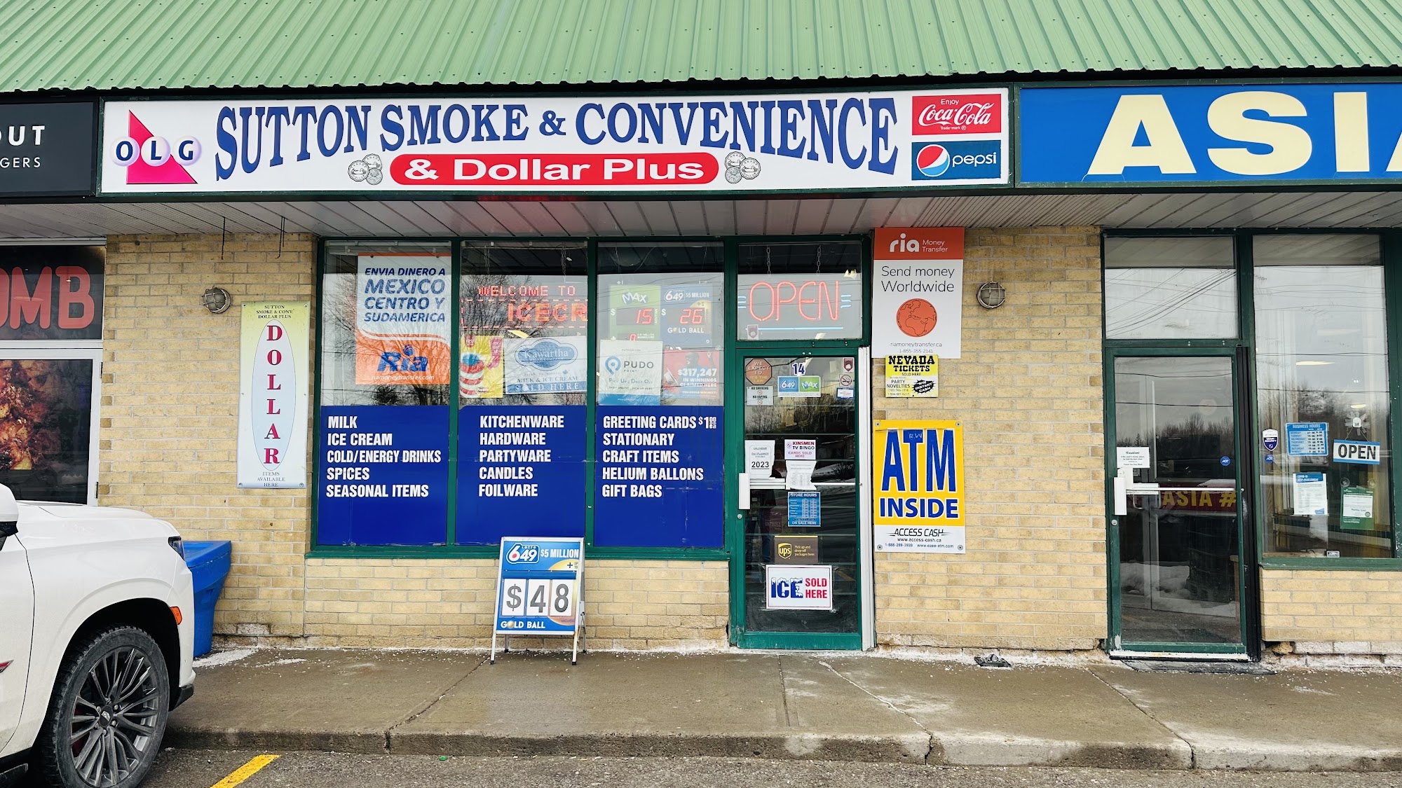 Sutton Smoke And Convenience DOLLAR PLUS Sutton